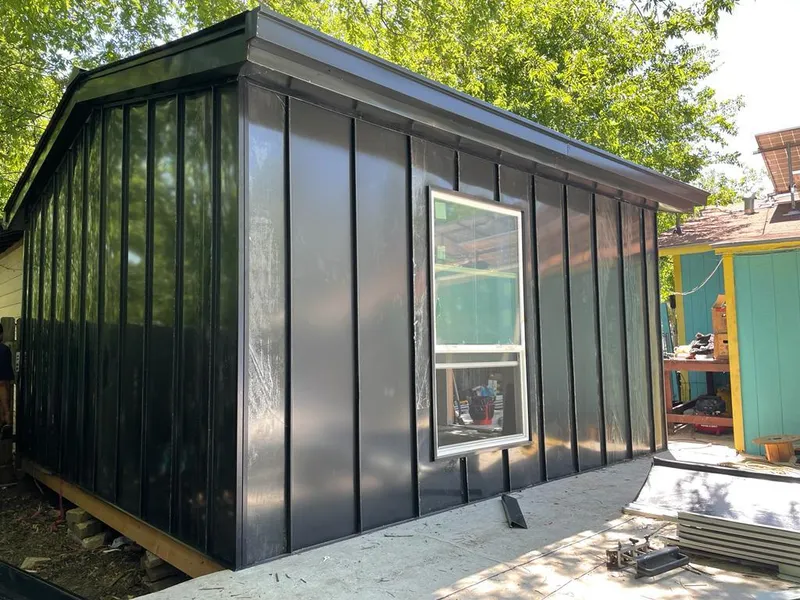 Black standing seam metal wall panels for Metal Roof Installation in Stuart