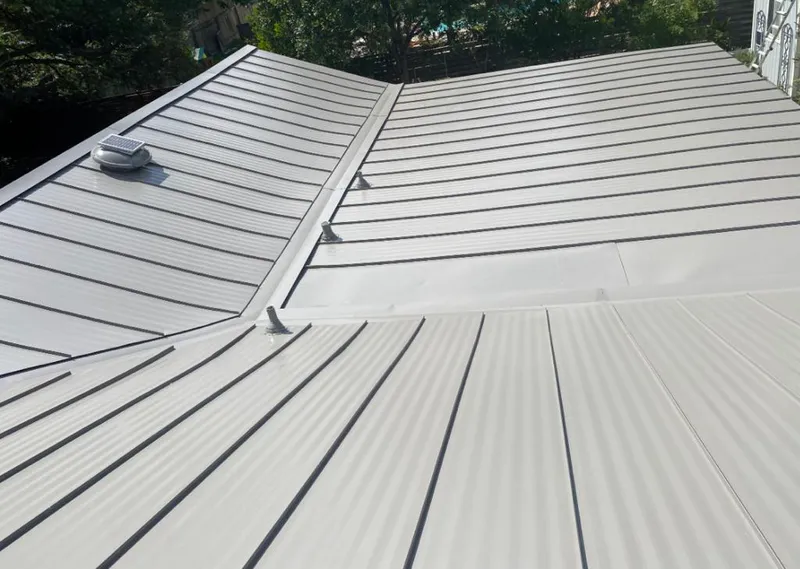 Solar attic fan installed on a metal roof for Roof Ventilation in Stuart